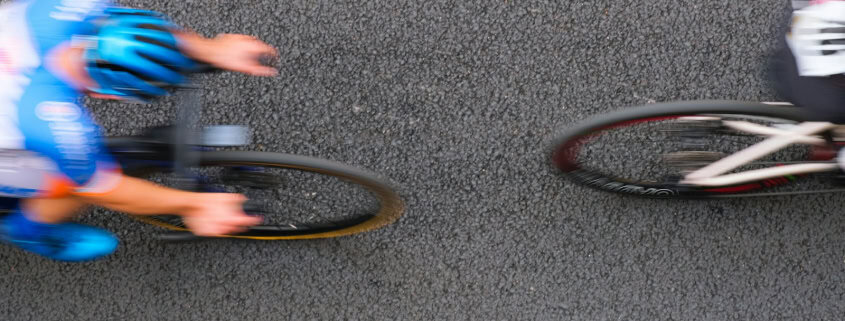 Cyclists racing on a road with motion blur